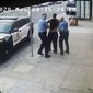 This image from video shows Minneapolis police Officers Thomas Lane, left and J. Alexander Kueng, right, escorting George Floyd, center, to a police vehicle outside Cup Foods in Minneapolis, on May 25, 2020. Three former Minneapolis officers headed to trial this week on federal civil rights charges in the death of George Floyd aren&#x27;t as familiar to most people as Derek Chauvin, a fellow officer who was convicted of murder last spring. (Court TV via AP, Pool, File)