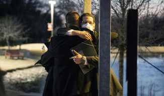 Congregation Beth Israel Rabbi Charlie Cytron-Walker, facing camera, hugs a man after a healing service Monday night, Jan. 17, 2022, at White&#39;s Chapel United Methodist Church in Southlake, Texas. Cytron-Walker was one of four people held hostage by a gunman at his Colleyville, Texas, synagogue on Saturday. (Yffy Yossifor/Star-Telegram via AP, File)