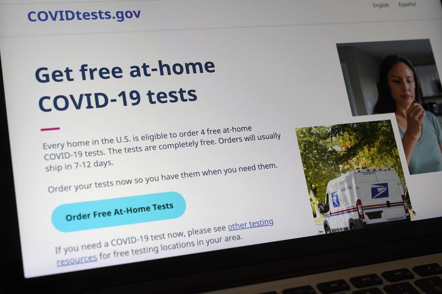 A United States government website is displayed on a computer, Wednesday, Jan. 19, 2022, in Walpole, Mass., that features a page where people can order free, at-home COVID-19 tests. The website, COVIDTests.gov, allows people to order four at-home tests per residence and have them delivered by mail. (AP Photo/Steven Senne) ** FILE **