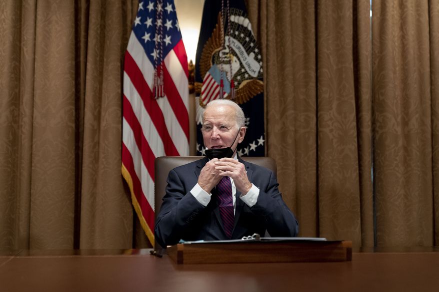 President Joe Biden meets with members of the Infrastructure Implementation Task Force to discuss the Bipartisan Infrastructure Law in the Cabinet Room at the White House in Washington, Thursday, Jan. 13, 2022. (AP Photo/Andrew Harnik)