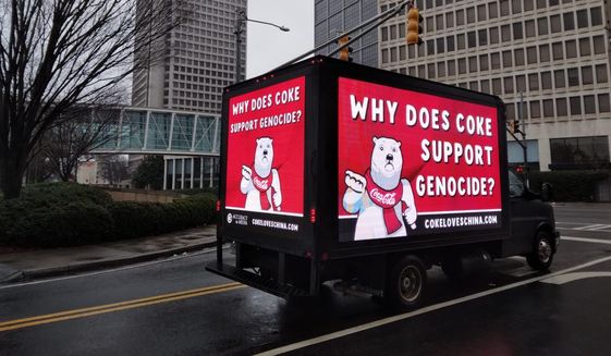 Accuracy in Media parked this mobile billboard truck outside of Coca-Cola&#39;s corporate headquarters in Atlanta on Thursday, calling on the soft drink giant to condemn China&#39;s human rights abuses (Photo courtesy of Accuracy in Media)