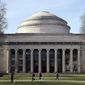 FILE - Students walk past the &quot;Great Dome&quot; atop Building 10 on the Massachusetts Institute of Technology campus, April 3, 2017, in Cambridge, Mass. The Justice Department dropped its case Thursday, Jan. 20, 2022 against MIT professor Gang Chen, charged last year with hiding work he did for the Chinese government, saying it &quot;could no longer meet its burden of proof at trial.&quot; Chen was accused last year of concealing ties to Beijing while also collecting U.S. dollars for his nanotechnology research. (AP Photo/Charles Krupa, File)