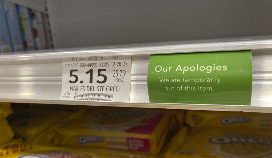 A sign attached to a store shelf alerts shoppers of that an item is temporarily out of stock, Thursday, Jan. 20, 2022, at a grocery store in Surfside, Fla. (AP Photo/Wilfredo Lee)