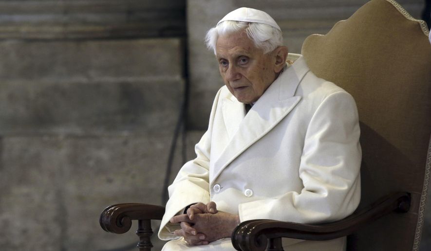 Pope Emeritus Benedict XVI sits in St. Peter&#39;s Basilica as he attends the ceremony marking the start of the Holy Year, at the Vatican, Dec. 8, 2015. A long-awaited report on the church&#39;s handling of cases of sexual abuse by clergy and others in Germany&#39;s Munich archdiocese and which was once led by retired Pope Benedict XVI from 1977 until 1982, is being released on Thursday, Jan. 20, 2022. (AP Photo/Gregorio Borgia, File)