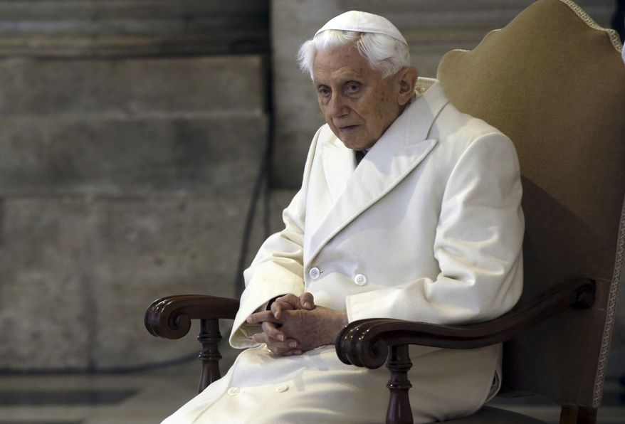 Pope Emeritus Benedict XVI sits in St. Peter&#39;s Basilica as he attends the ceremony marking the start of the Holy Year, at the Vatican, Dec. 8, 2015. A long-awaited report on the church&#39;s handling of cases of sexual abuse by clergy and others in Germany&#39;s Munich archdiocese and which was once led by retired Pope Benedict XVI from 1977 until 1982, is being released on Thursday, Jan. 20, 2022. (AP Photo/Gregorio Borgia, File)
