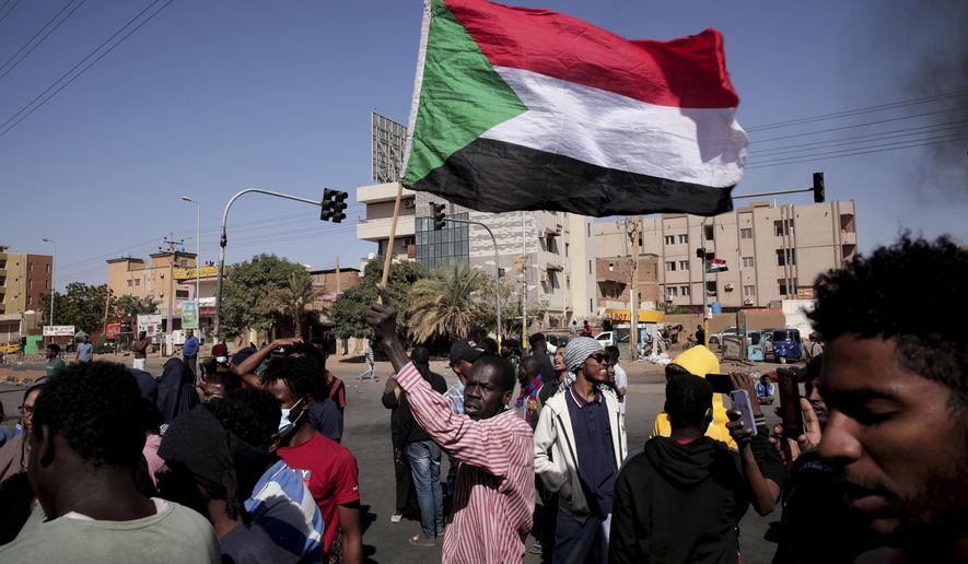 People chant slogans during a demonstration against the killing of dozens by Sudanese security forces since the Oct. 25, 2021 military takeover, in Khartoum, Sudan, Thursday, Jan. 20, 2022. (AP Photo/Marwan Ali)