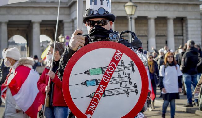 A man takes part in a demonstration against the country&#x27;s coronavirus restrictions in Vienna, Austria, Nov. 20, 2021. Austria&#x27;s parliament is due to vote Thursday, Jan. 20, 2022, on plans to introduce a COVID-19 vaccine mandate for the adult population, the first of its kind in Europe. (AP Photo/Lisa Leutner, File)