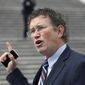 Rep. Thomas Massie, R-Ky., talks to reporters before leaving Capitol Hill in Washington, on Friday, March 27, 2020. (AP Photo/Susan Walsh, File)