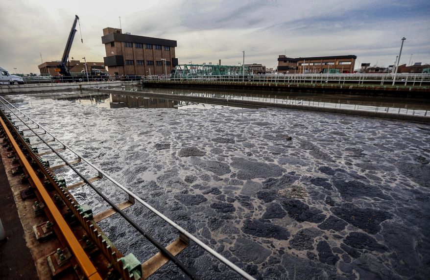 In this file photo, wastewater sits inside of a partially operating treatment tank at the Passaic Valley Sewerage Commission, Thursday, Nov. 15, 2012, in Newark, N.J. The CDC announced on Feb. 4, 2022, that it is expanding efforts to sample wastewater for the coronavirus and is posting data from its national surveillance network for the first time on its online COVID-19 tracker. (AP Photo/Julio Cortez, File) **FILE**