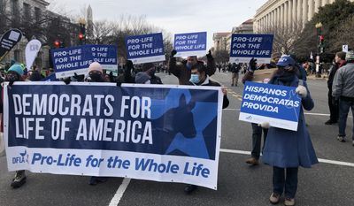 In this Jan. 21, 2020, photo a group of Democrats for Life demonstrators participate in the 49th annual March for Life near the National Mall.