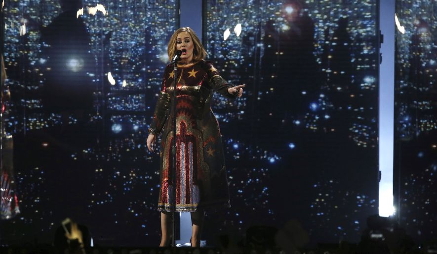 Singer Adele performs onstage at the Brit Awards 2016 at the 02 Arena in London, Wednesday, Feb. 24, 2016.  Adele has postponed a 24-date Las Vegas residency hours before it was to start, citing delivery delays and coronavirus illness in her crew. The chart-topping British singer said she was “gutted” and promised to reschedule the shows. In a video message posted on social media, a tearful Adele said: “I’m so sorry but my show ain’t ready.” (Photo by Joel Ryan/Invision/AP, File)