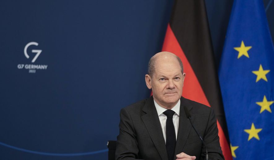 German Chancellor Olaf Scholz sits in front of a camera prior to his speech for the Davos Agenda 2022, at the chancellery in Berlin, Germany, Wednesday, Jan. 19, 2022. Mr. Scholz&#39;s government has declined to send arms to Ukrainian defense forces amid fears of an imminent Russian invasion. (AP Photo/Markus Schreiber, Pool)