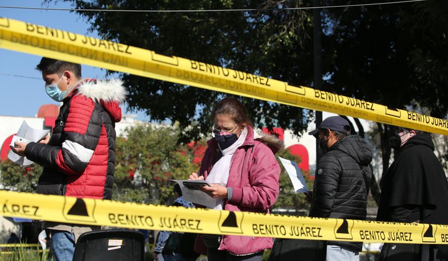 People line up to be tested for COVID-19, in the Benito Juarez borough of Mexico City, Saturday, Jan. 15, 2022. (AP Photo/Ginnette Riquelme) ** FILE **