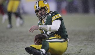 Green Bay Packers&#39; Aaron Rodgers reacts after being sacked by San Francisco 49ers&#39; Arik Armstead during the second half of an NFC divisional playoff NFL football game Saturday, Jan. 22, 2022, in Green Bay, Wis. (AP Photo/Aaron Gash)