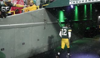 Green Bay Packers&#x27; Aaron Rodgers leaves the field after an NFC divisional playoff NFL football game against the San Francisco 49ers Saturday, Jan. 22, 2022, in Green Bay, Wis. The 49ers won 13-10 to advance to the NFC Chasmpionship game. (AP Photo/Morry Gash)
