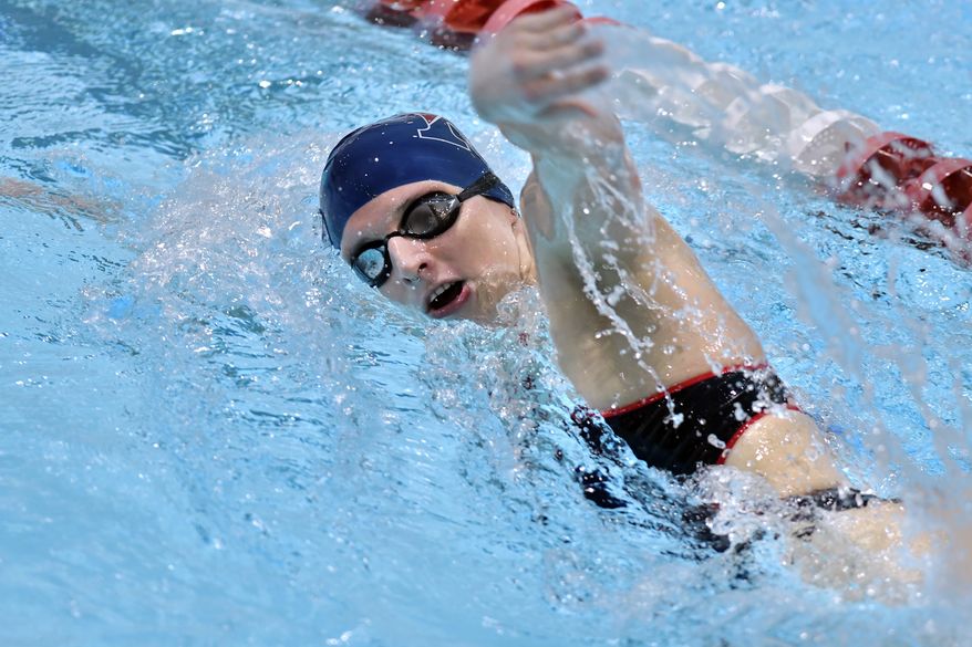 Transgender swimmer Lia Thomas, right during a meet with Harvard on Saturday, Jan. 22, 2022, at at Harvard University in Cambridge, Mass. Thomas won the two individual events in which she competed. (AP Photo/Josh Reynolds)