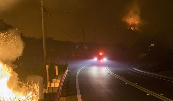 The Colorado Fire burns along Highway 1 near Big Sur, Calif., Saturday, Jan. 22, 2022. (AP Photo/Nic Coury)
