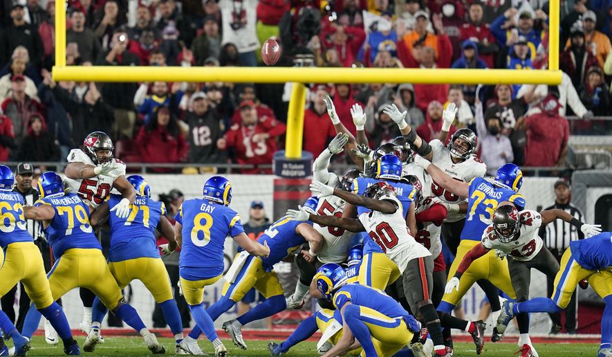 Los Angeles Rams&#x27; Matt Gay (8) kicks a 30-yard field goal to defeat the Tampa Bay Buccaneers during the second half of an NFL divisional round playoff football game Sunday, Jan. 23, 2022, in Tampa, Fla. (AP Photo/John Raoux)