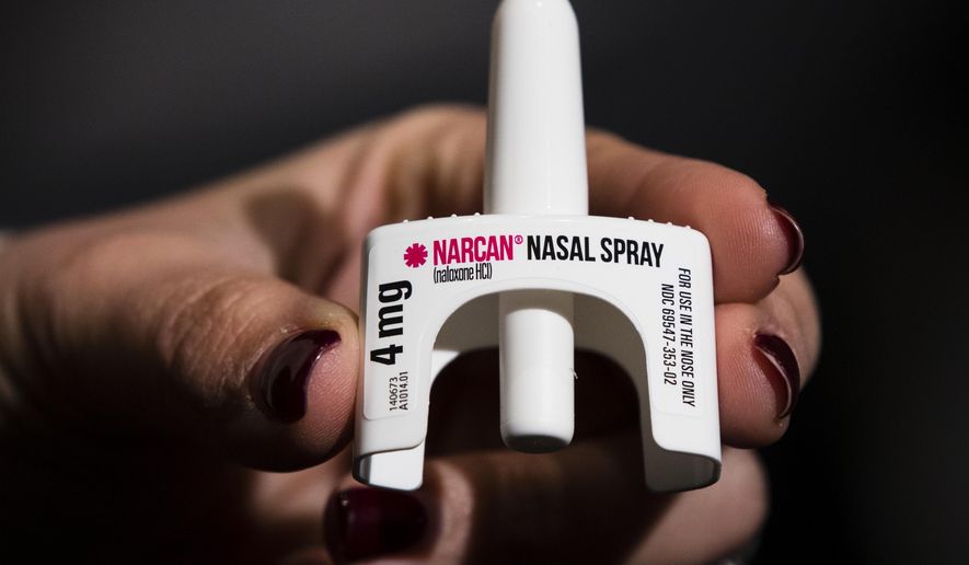 FILE - The overdose-reversal drug Narcan is displayed during training for employees of the Public Health Management Corporation (PHMC), Dec. 4, 2018, in Philadelphia. The death of a Connecticut seventh grader from an apparent fentanyl overdose has renewed calls for schools to carry the opioid antidote naloxone. The 13-year-old student in Hartford died Saturday after falling ill in school two days earlier. The school did not have naloxone, which is known by the brand name Narcan. But now city officials are vowing to put it in all schools. Fatal overdoses among young people in the U.S. have been increasing amid the opioid epidemic but remain relatively uncommon. (AP Photo/Matt Rourke, file)