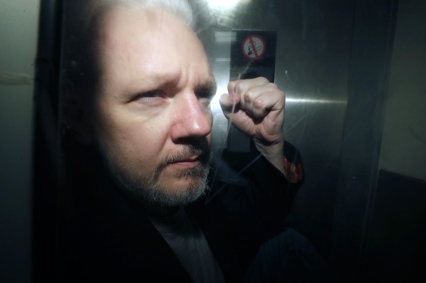 WikiLeaks founder Julian Assange being taken from court, where he appeared on charges of jumping British bail seven years ago, in London, Wednesday May 1, 2019. Britain&#39;s High Court is set to rule on whether WikiLeaks founder Julian Assange can take his fight against U.S. extradition to the U.K. Supreme Court. The decision is the latest step in Assange&#39;s long battle to avoid being sent to the United States to face espionage charges over WikiLeaks&#39; publication of classified documents. (AP Photo/Matt Dunham, File)