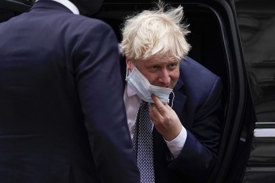 Britain&#39;s Prime Minister Boris Johnson arrives at 10 Downing Street, in London, Monday, Jan. 24, 2022.(AP Photo/Alberto Pezzali)