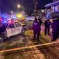 Police investigate the scene where five people were found dead in a Milwaukee, Wisc., home, Sunday, Jan. 23, 2022, in what police are investigating as multiple homicides, authorities said. (Mike De Sisti/Milwaukee Journal-Sentinel via AP)