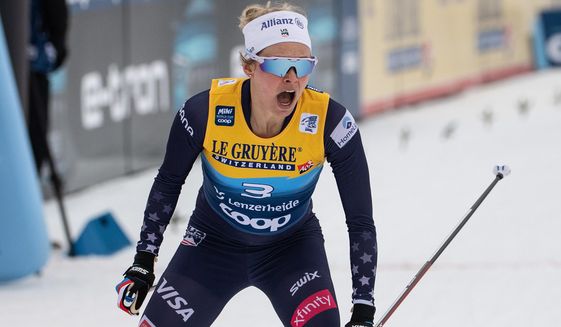 United States&#39; Jessie Diggins celebrates winning a cross-country ski sprint event at the FIS Tour de Ski in Lenzerheide, Switzerland, Tuesday, Dec. 28, 2021. Diggins literally wrote the book on the struggles female athletes face as they try to stay fit while dealing with unrealistic pressures to have a certain body type. (Peter Schneider/Keystone via AP, File) **FILE**