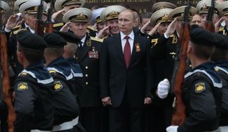 Russian President Vladimir Putin attends a parade marking the Victory Day in Sevastopol, Crimea, on May 9, 2014. Russia&#39;s present demands are based on Putin&#39;s purported long sense of grievance and his rejection of Ukraine and Belarus as truly separate, sovereign countries but rather as part of a Russian linguistic and Orthodox motherland. (AP Photo/Ivan Sekretarev) **FILE**