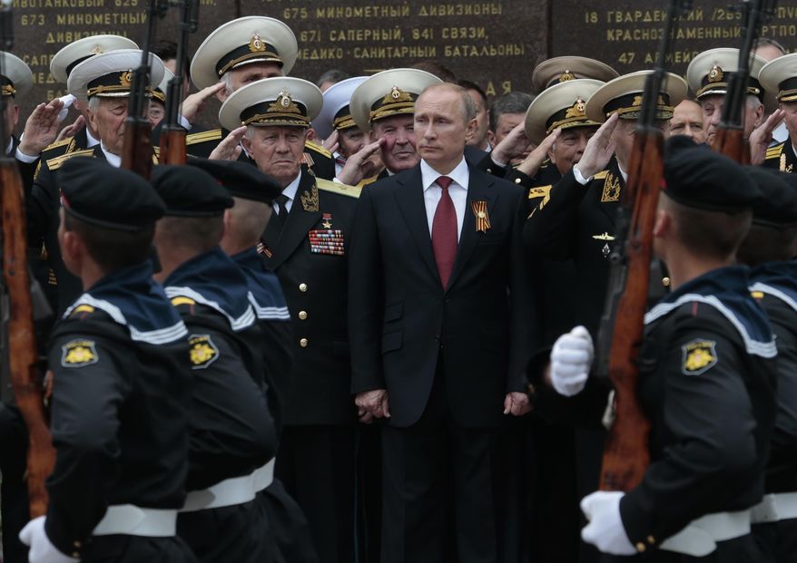 Russian President Vladimir Putin attends a parade marking the Victory Day in Sevastopol, Crimea, on May 9, 2014. Russia's present demands are based on Putin's purported long sense of grievance and his rejection of Ukraine and Belarus as truly separate, sovereign countries but rather as part of a Russian linguistic and Orthodox motherland. (AP Photo/Ivan Sekretarev) **FILE**