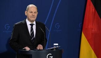 German Chancellor Olaf Scholz speaks during a media conference with French President Emmanuel Macron ahead of their meeting at the chancellery in Berlin, Germany, Tuesday, Jan. 25, 2022. (Tobias Schwarz/Pool Photo via AP, File)