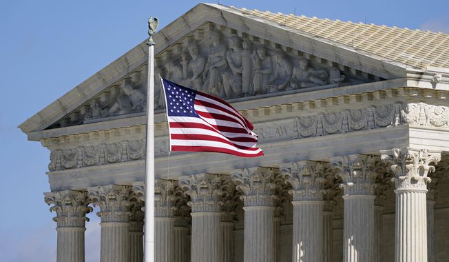 An American flag waves in front of the Supreme Court building on Capitol Hill in Washington, on Nov. 2, 2020, in this file photo.  (AP Photo/Patrick Semansky, File)