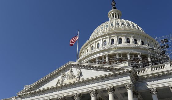 An American flag flies over Capitol Hill in Washington, Sept. 6, 2016. In the last month, two states — Nebraska and Wisconsin — have passed resolutions to hold an Article V convention focused on clipping the wings of the federal government, bringing the total to 17 states, or half of the 34 needed to trigger the event. (AP Photo/Susan Walsh, File)