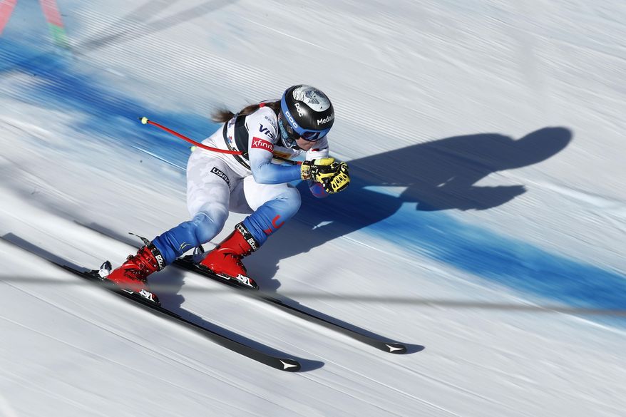 United States&#39; Breezy Johnson speeds down the course during an alpine ski, women&#39;s World Cup downhill training, in Cortina d&#39;Ampezzo, Italy, Friday, Jan. 21, 2022. (AP Photo/Gabriele Facciotti)
