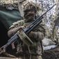 A Ukrainian soldier stands at the line of separation from pro-Russian rebels, Donetsk region, Ukraine, Monday, Jan. 10, 2022. Germany&#39;s refusal to join other NATO members in supplying Ukraine with weapons has frustrated allies and prompted some to question Berlin&#39;s resolve in standing up to Russia. (AP Photo/Andriy Dubchak,file)