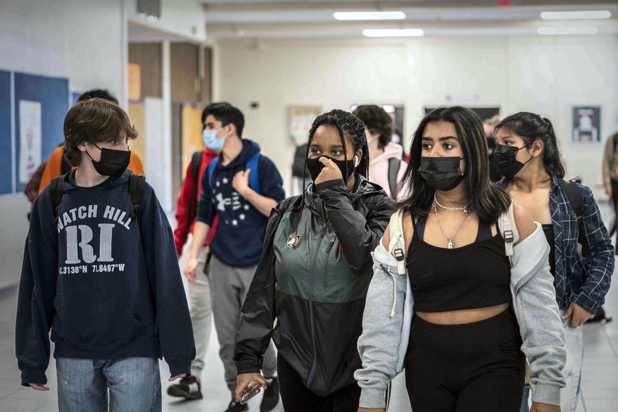 White Plains High School students walk between classes in White Plains, N.Y., April 22, 2021. (AP Photo/Mark Lennihan, File)