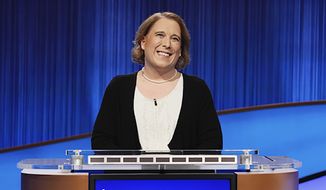 This image released by Sony Pictures Television shows contestant Amy Schneider on the set of &quot;Jeopardy!&quot; After 40 games, Schneider&#39;s winning streak has ended. (Casey Durkin/Sony Pictures Television via AP)
