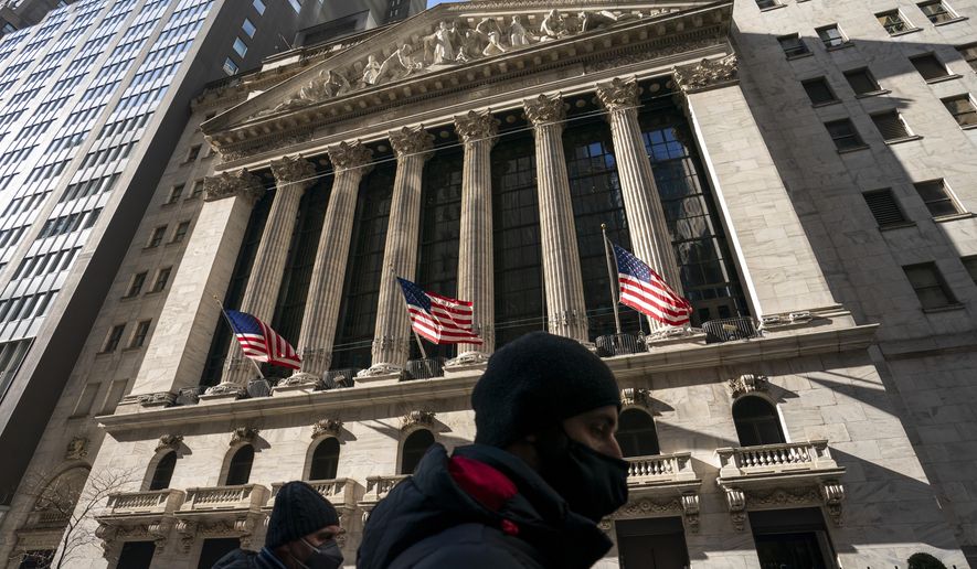 A pedestrian passes the New York Stock Exchange, Monday, Jan. 24, 2022, in New York. Stocks have fallen sharply so far this year as the market readies for the Federal Reserve to raise interest rates to try to tame inflation, which is at its highest level in nearly four decades. (AP Photo/John Minchillo)