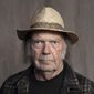 Neil Young poses for a portrait in Santa Monica, Calif. on Sept. 9, 2019. Spotify says it will grant the veteran rocker&#39;s request to remove his music from its streaming platform. Young made the request as a protest to what he called the company&#39;s decision to allow COVID-19 misinformation to spread on its service. (Photo by Rebecca Cabage/Invision/AP, File)