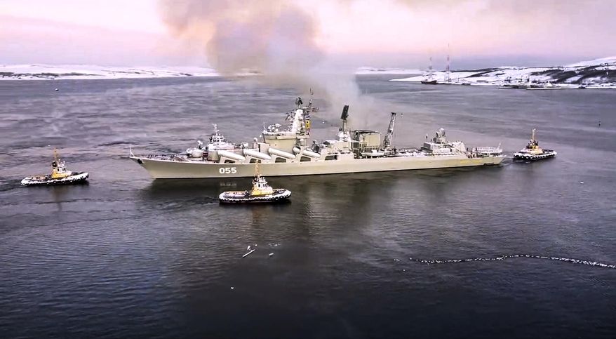 In this photo taken from video and released by the Russian Defense Ministry Press Service on Wednesday, Jan. 26, 2022, the Russian navy&#39;s missile cruiser Marshal Ustinov sails off for an exercise in the Arctic. Russia has launched a series of drills amid the tensions over Ukraine and deployed an estimated 100,000 troops near the Ukrainian territory that fueled Western fears of an invasion. (Russian Defense Ministry Press Service via AP)