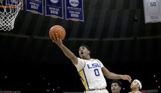 LSU guard Brandon Murray (0) shoots ahead of Texas A&amp;amp;M forward Henry Coleman III (15) during the first half of an NCAA college basketball game in Baton Rouge, La., Wednesday, Jan. 26, 2022. (AP Photo/Matthew Hinton) **FILE**