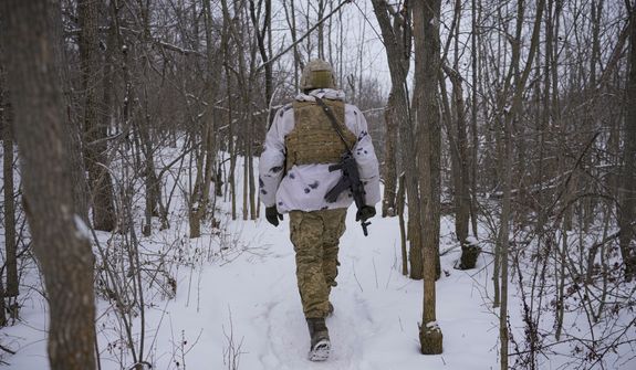 An Ukrainian serviceman heads to an advanced position on the front line in the Luhansk area, eastern Ukraine, Thursday, Jan. 27, 2022. The U.S. rejection of Russia&#39;s main demands to resolve the crisis over Ukraine left &quot;little ground for optimism,&quot; the Kremlin said Thursday, but added that dialogue was still possible. (AP Photo/Vadim Ghirda)