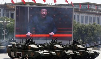 Chinese President Xi Jinping is displayed on a screen as Type 99A2 Chinese battle tanks take part in a parade commemorating the 70th anniversary of Japan&#39;s surrender during World War II, held in front of Tiananmen Gate in Beijing on Thursday, Sept. 3, 2015. From the military suppression of Beijing’s 1989 pro-democracy protests to the less deadly crushing of Hong Kong’s opposition four decades later, China’s long-ruling Communist Party has demonstrated a determination and ability to stay in power that is seemingly impervious to Western criticism and sanctions. (AP Photo/Ng Han Guan, File)