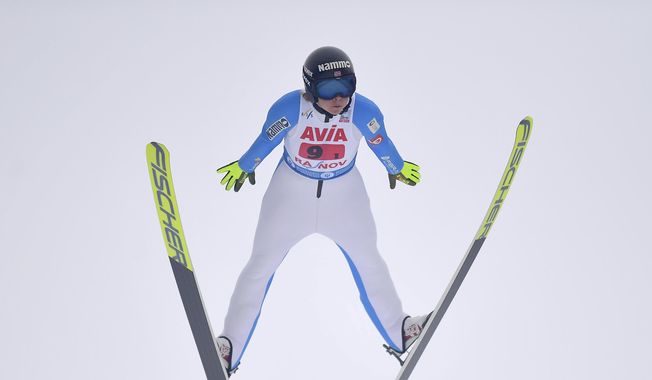 Norway&#x27;s Maren Lundby competes in the mixed team ski jumping World Cup event in Rasnov, Romania, on Feb. 20, 2021. Lundby has emerged as an advocate for change in a sport that has historically had athletes develop eating disorders in a quest to be as light as possible to fly farther. (AP Photo/Raed Krishan, File) **FILE**