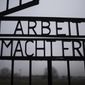 The gate of the Sachsenhausen Nazi death camp with the phrase &#39;Arbeit macht frei&#39; (work sets you free) stands open in Oranienburg, about 30 kilometers (18 miles) north of Berlin, Germany, Tuesday, Jan. 25, 2022. On Thursday Jan. 27, 2022 the International Holocaust Remembrance Day marks the liberation of the Auschwitz Nazi death camp on Jan. 27, 1945. (AP Photo/Markus Schreiber)