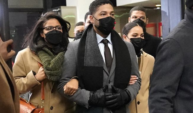 Actor Jussie Smollett, center, leaves the Leighton Criminal Courthouse with unidentified siblings, Thursday, Dec. 9, 2021, in Chicago, following a verdict in his trial. Smollett, who was found guilty last month of lying to police about a hate crime that authorities said he staged, will return to court for sentencing on March 10, a judge announced on Thursday, Jan. 27, 2022. (AP Photo/Nam Y. Huh, File)  **FILE**