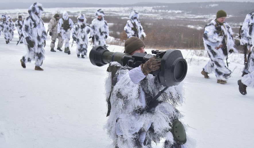 Ukrainian soldiers take part in an exercise for the use of NLAW anti-tank missiles at the Yavoriv military training ground, close to Lviv, western Ukraine, Friday, Jan. 28, 2022. British defense secretary Ben Wallace told the U.K. had already delivered 2,000 NLAWs to Ukraine, a number he indicated might continue to rise. The missiles were London&#39;s way of providing defensive aid to Kyiv as Russian forces deploying around Ukraine&#39;s borders give the impression a new invasion may be imminent. (AP Photo/Pavlo Palamarchuk)