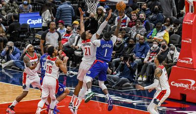 Wizards center Daniel Gafford contests a shot from Clippers guard Reggie Jackson, from Washington Wizards vs. Los Angeles Clippers at Captial One Arena, Washington, D.C., January 25th, 2022 (Photo: Joe Glorioso | All-Pro Reels)