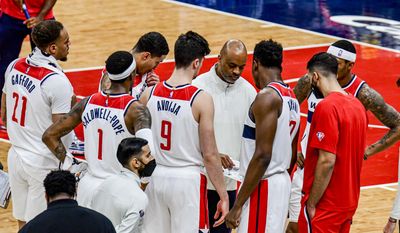 Wizards coach Wes Unseld Jr. talks to his team during a timeout, from Washington Wizards vs. Los Angeles Clippers at Captial One Arena, Washington, D.C., January 25th, 2022 (Photo: Joe Glorioso | All-Pro Reels)