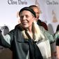 FILE - Joni Mitchell arrives at the 2015 Clive Davis Pre-Grammy Gala in Beverly Hills, Calif. Feb. 7, 2015. Joni Mitchell said Friday, Jan. 28, 2022 she seeks to remove all of her music in Spotify in solidarity with Neil Young, who ignited a protest against the streaming service for airing a podcast that featured a figure who has spread misinformation about the coronavirus. (Photo by John Shearer/Invision/AP, File)