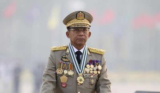 Myanmar&#39;s Commander-in-Chief Senior General Min Aung Hlaing presides an army parade on Armed Forces Day in Naypyitaw, Myanmar, Saturday, March 27, 2021. The army takeover in Myanmar a year ago that ousted the elected government of Aung San Suu Kyi brought a shocking end to the effort to restore democratic rule in the Southeast Asian country after decades of military rule. But at least as surprising has been the level of popular resistance to the seizure of power, which has blossomed into an insurgency that raises the specter of a protracted civil war. (AP Photo)